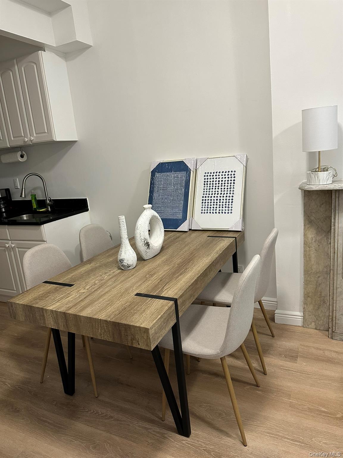 1435 2nd Avenue Manhattan, NY 10021 - Photo 25 of 33 a view of a dining room with furniture and wooden floor