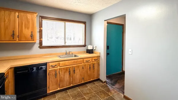 a view of a sink and a window