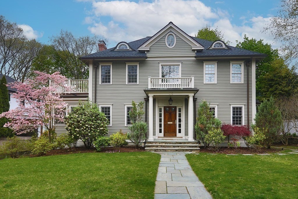 a front view of a house with garden