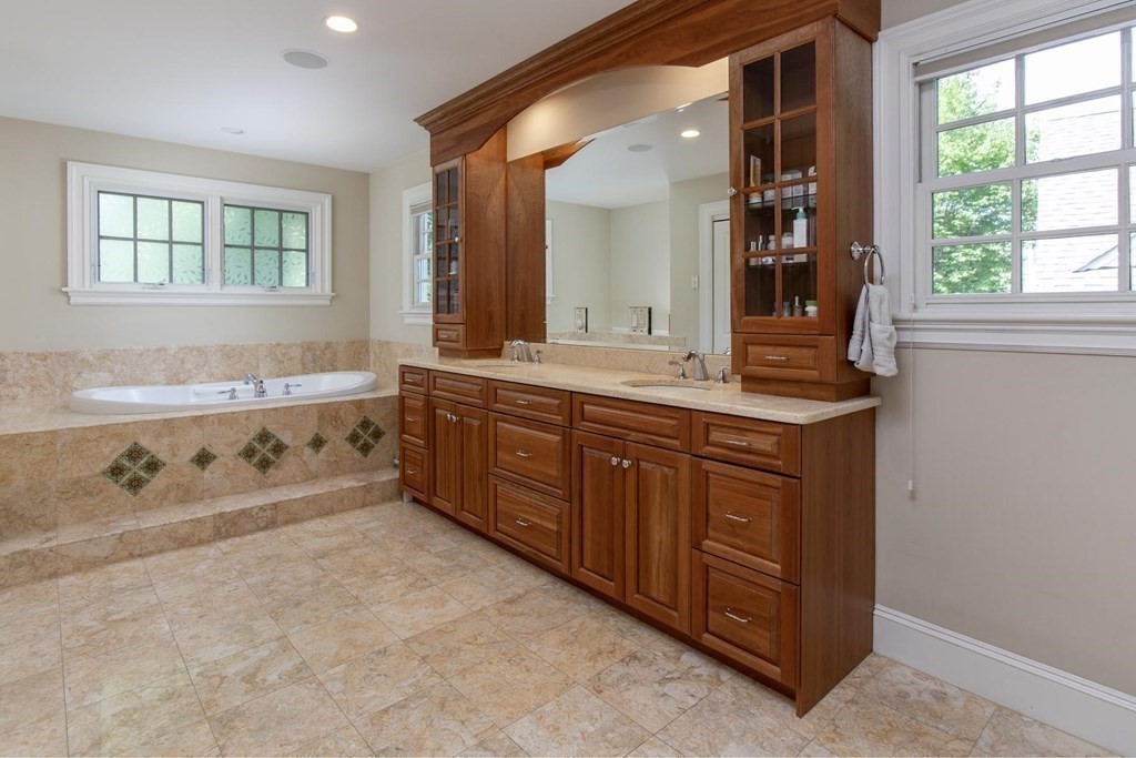 43 Carlton Road Newton, MA 02468 - Photo 11 of 23 a spacious bathroom with a tub sink and mirror