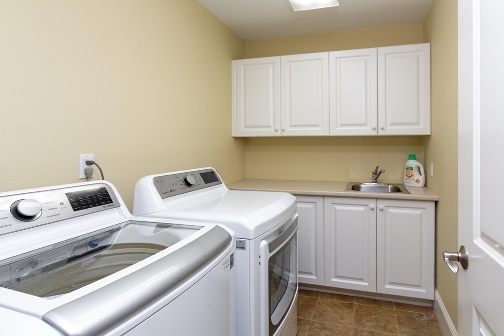 43 Carlton Road Newton, MA 02468 - Photo 17 of 23 a utility room with sink dryer and washer