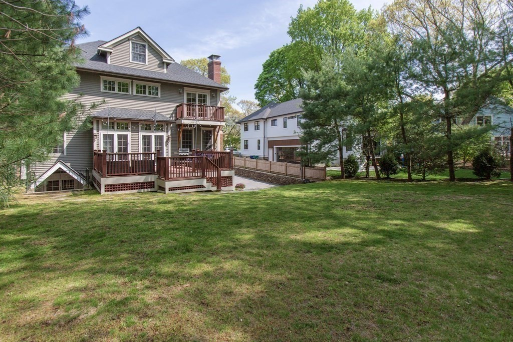 43 Carlton Road Newton, MA 02468 - Photo 19 of 23 a view of a house with a big yard and large trees