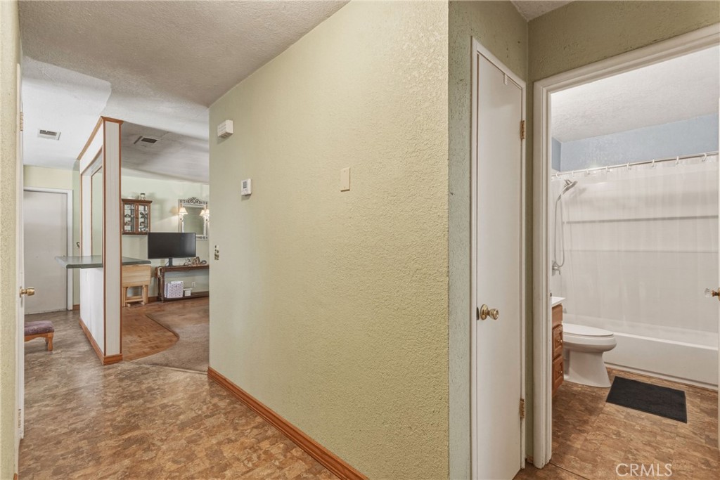 6812 Helton Street Winton, CA 95388 - Photo 13 of 24 a bathroom with a toilet and a shower