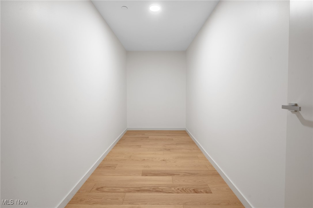 22700 Lake Road, Unit 306 Rocky River, OH 44116 - Photo 22 of 28 Hall with light wood finished floors and baseboards
