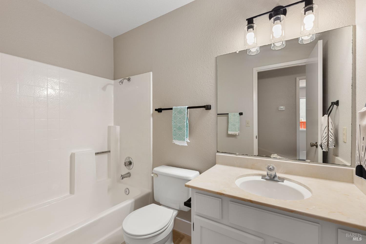 828 Stoneridge Circle Fairfield, CA 94534 - Photo 22 of 37 a bathroom with a sink toilet and shower