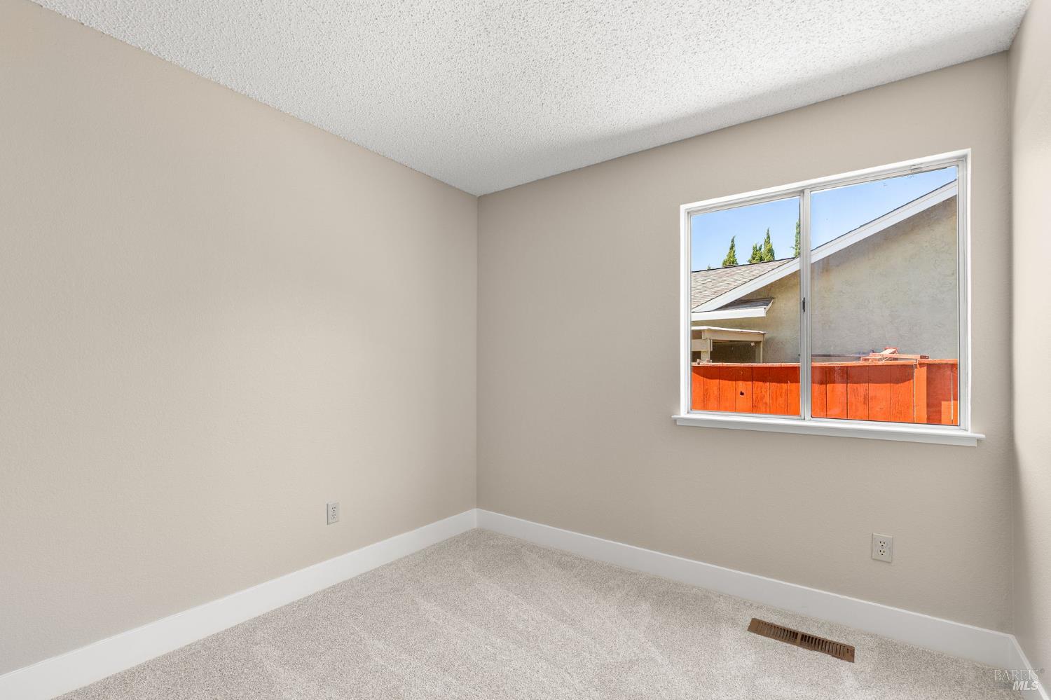 828 Stoneridge Circle Fairfield, CA 94534 - Photo 26 of 37 a view of an empty room with a window