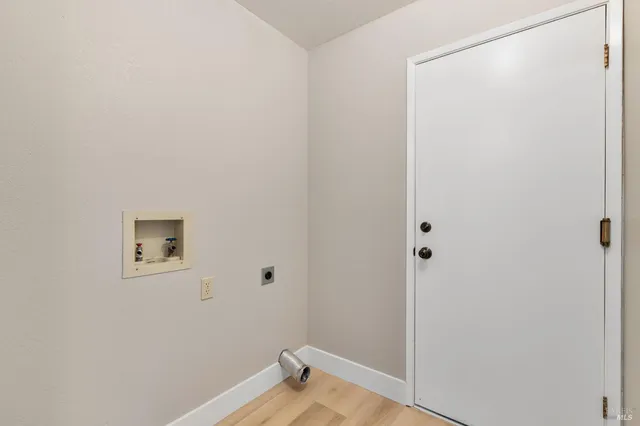 a view of a small space with wooden floor