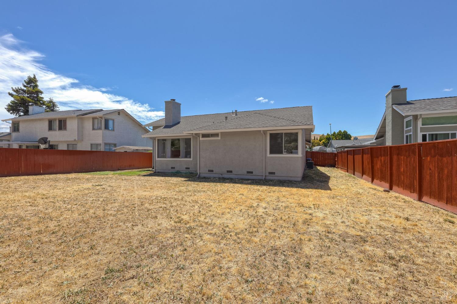 828 Stoneridge Circle Fairfield, CA 94534 - Photo 36 of 37 a backyard of a house with wooden fence