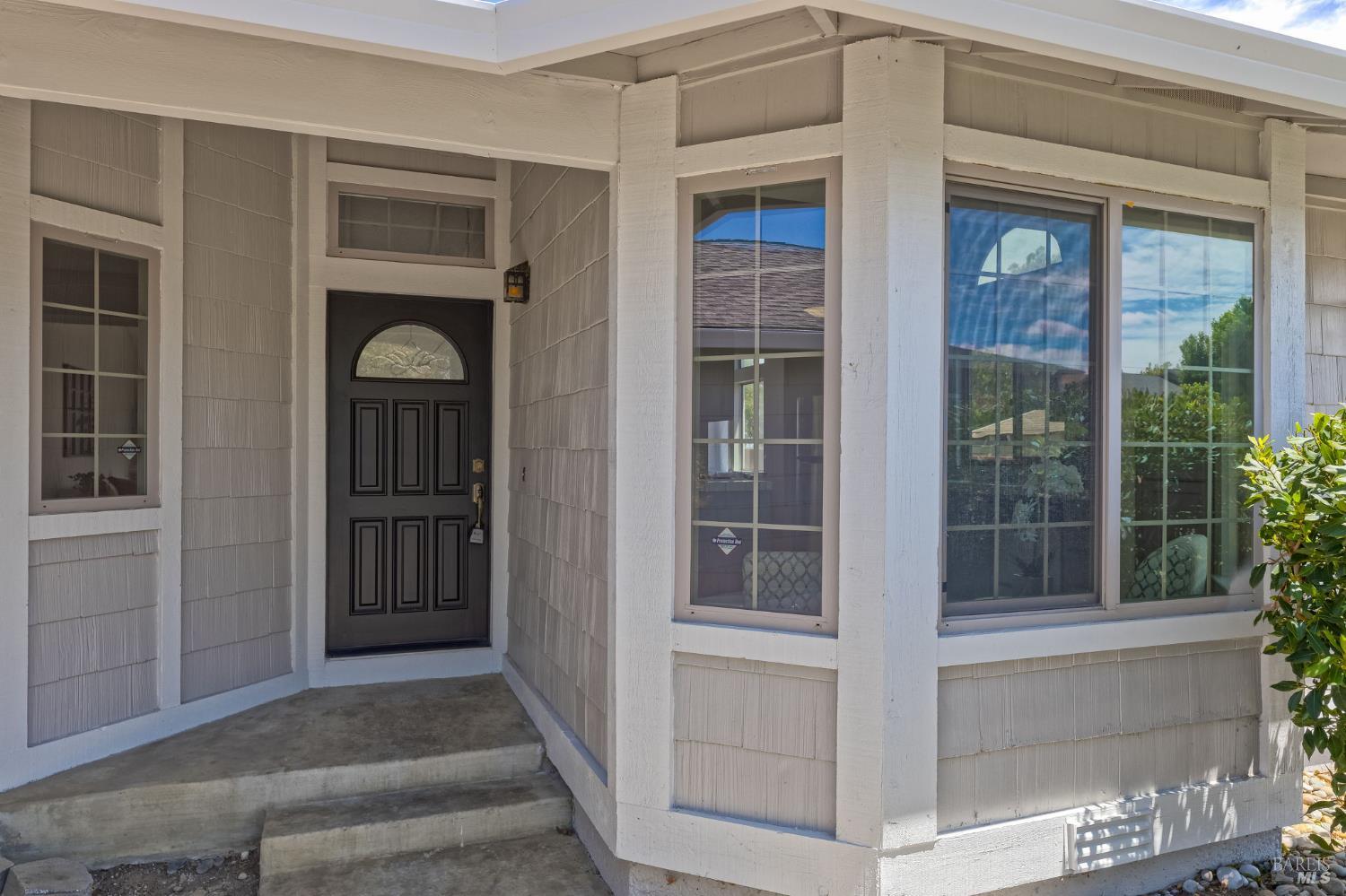 828 Stoneridge Circle Fairfield, CA 94534 - Photo 5 of 37 a front view of a house with a glass door