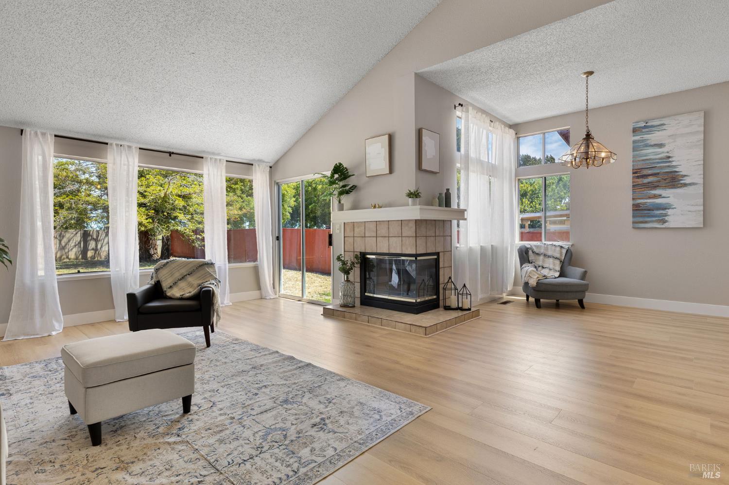 828 Stoneridge Circle Fairfield, CA 94534 - Photo 8 of 37 a living room with furniture and a fireplace