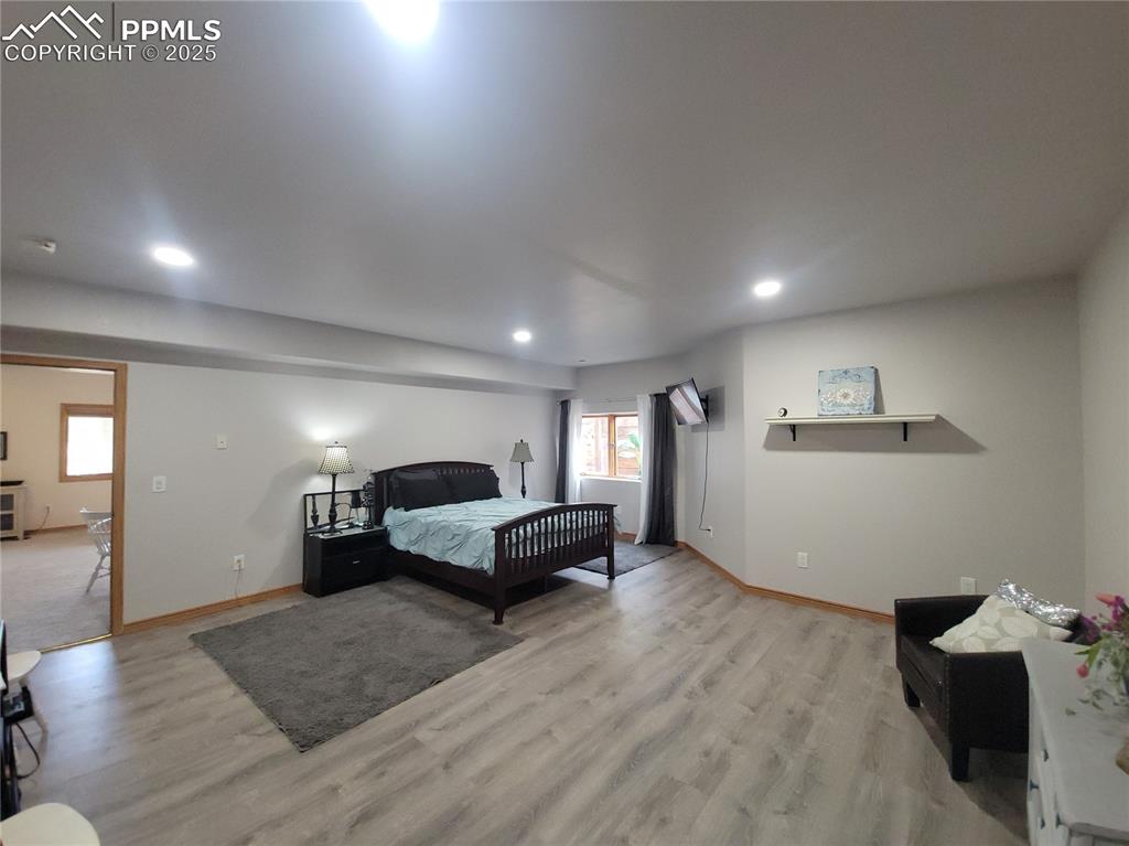 730 Winding Hills Road Monument, CO 80132 - Photo 26 of 42 a living room with furniture and a couch