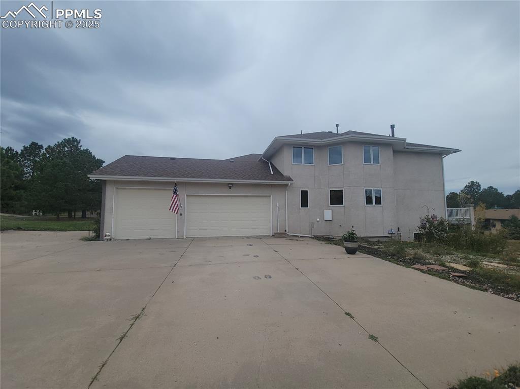 730 Winding Hills Road Monument, CO 80132 - Photo 3 of 42 front view of house with a yard