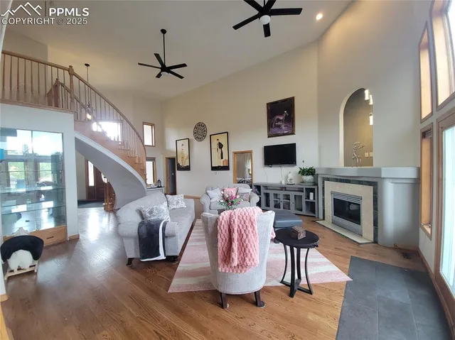 a living room with furniture fireplace and flat screen tv