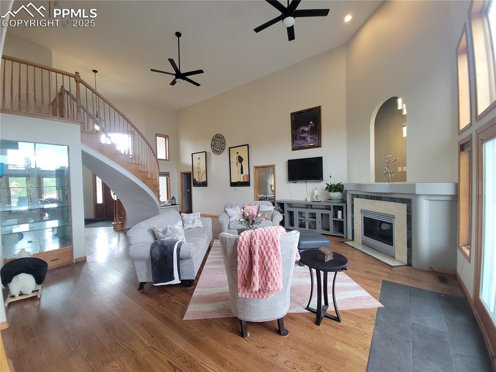 730 Winding Hills Road Monument, CO 80132 - Photo 7 of 42 a living room with furniture fireplace and flat screen tv