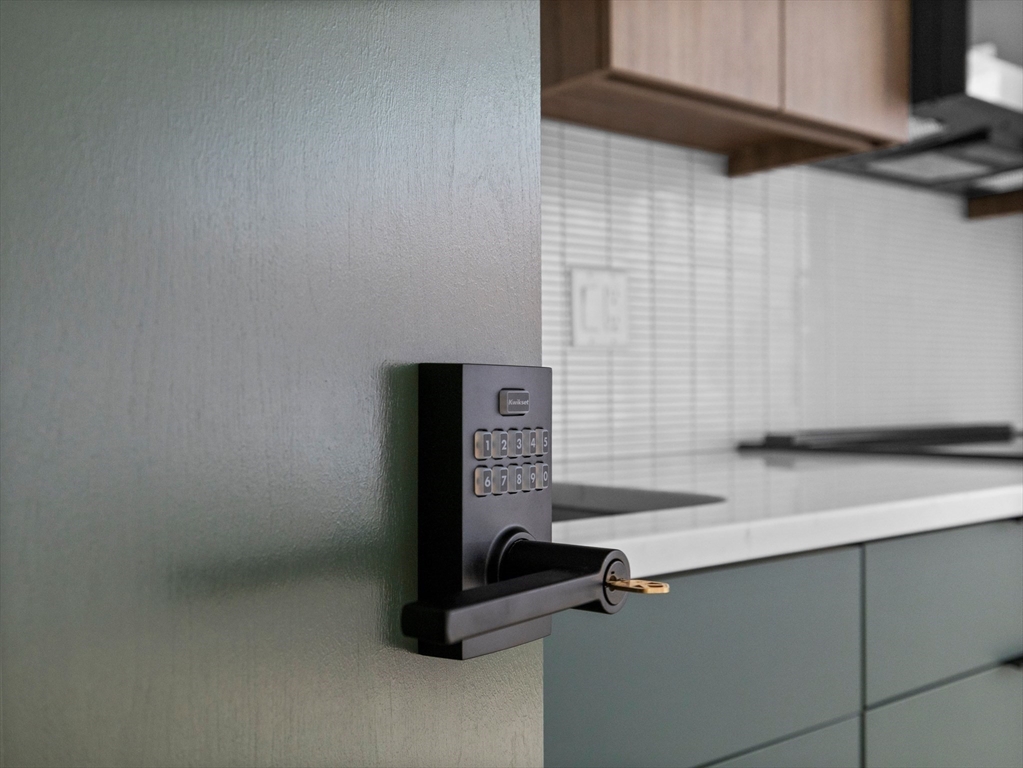 27 Dixwell Street, Unit 1 Boston, MA 02119 - Photo 9 of 13 a view of a storage and utility room with two washing machine