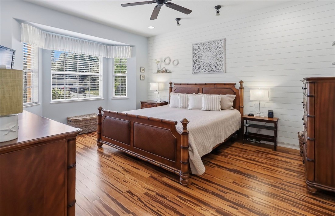 1771 Mistletoe Street Sebastian, FL 32958 - Photo 15 of 36 a large bedroom with a bed and wooden floor