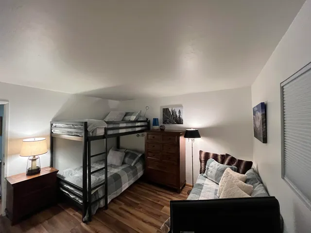 a bedroom with furniture and a window