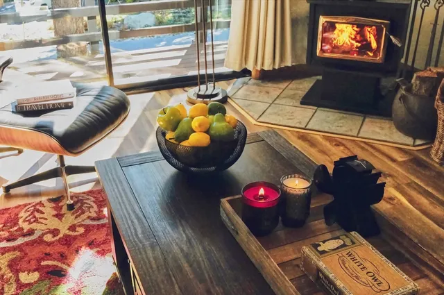 a living room with furniture and floor to ceiling windows
