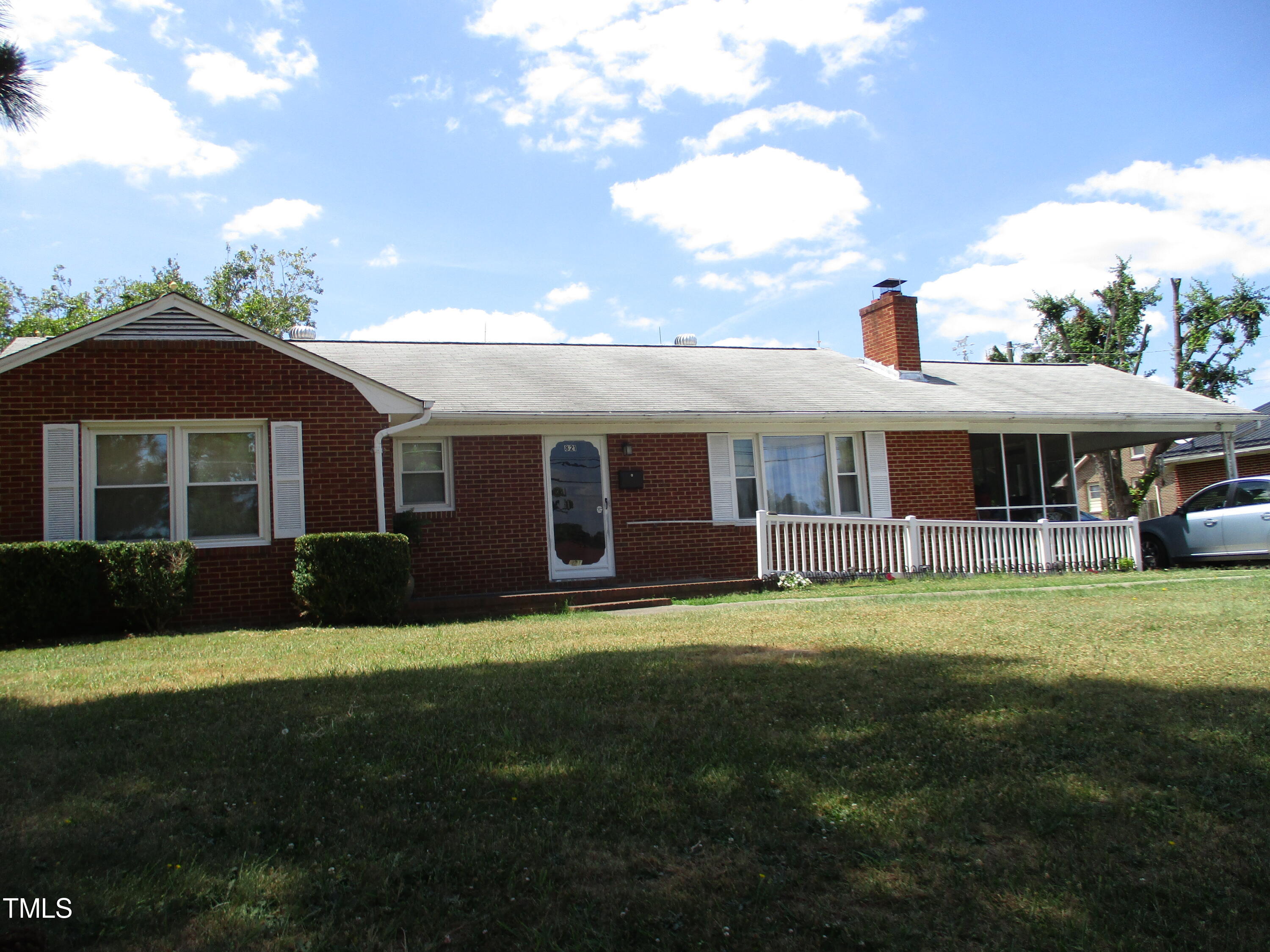 821 South Main Street Roxboro, NC 27573 - Photo 2 of 9 a front view of a house with a garden