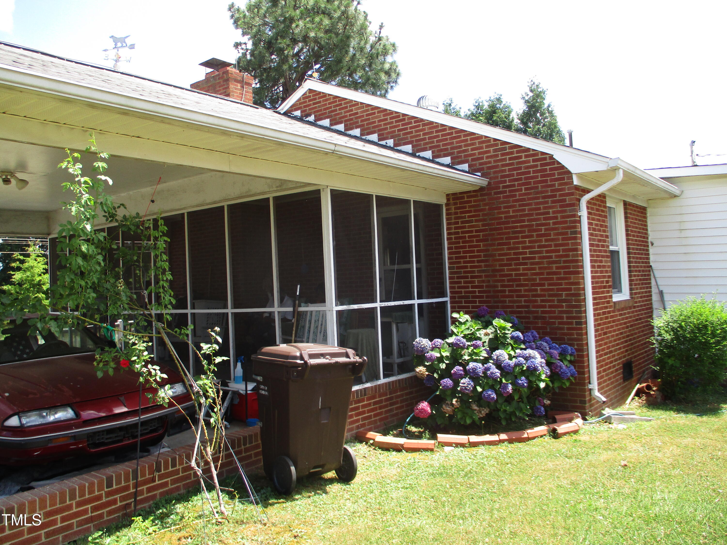 821 South Main Street Roxboro, NC 27573 - Photo 6 of 9 a view of a house with outdoor seating and plants