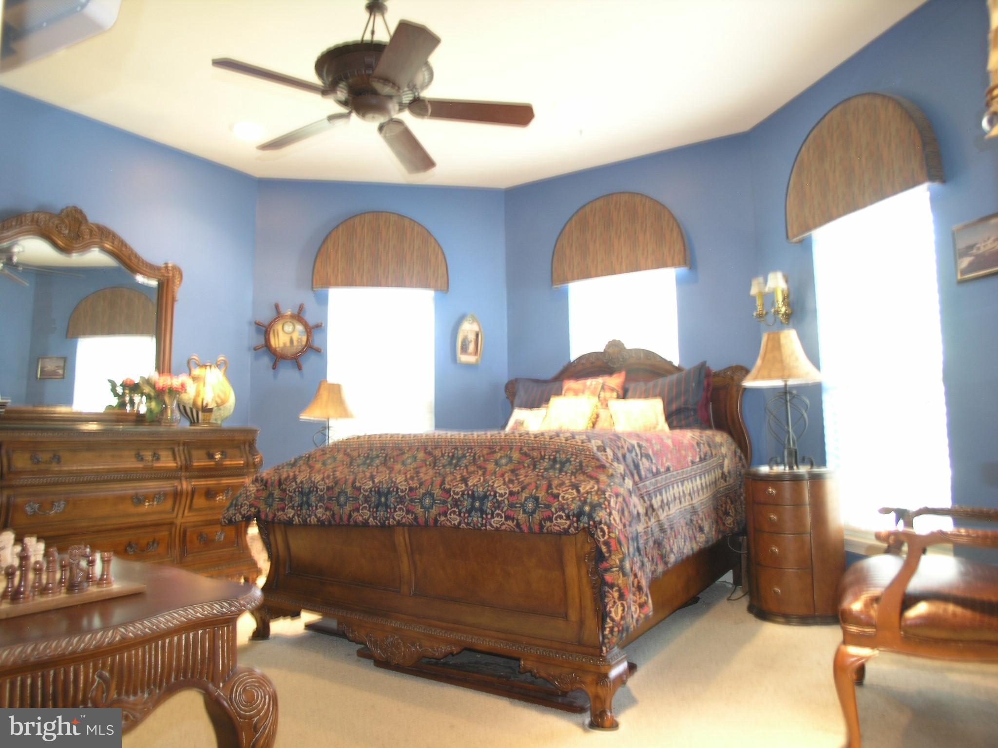 950 Nathaniel Trail Warminster, PA 18974 - Photo 15 of 26 a bedroom with a bed and a chandelier