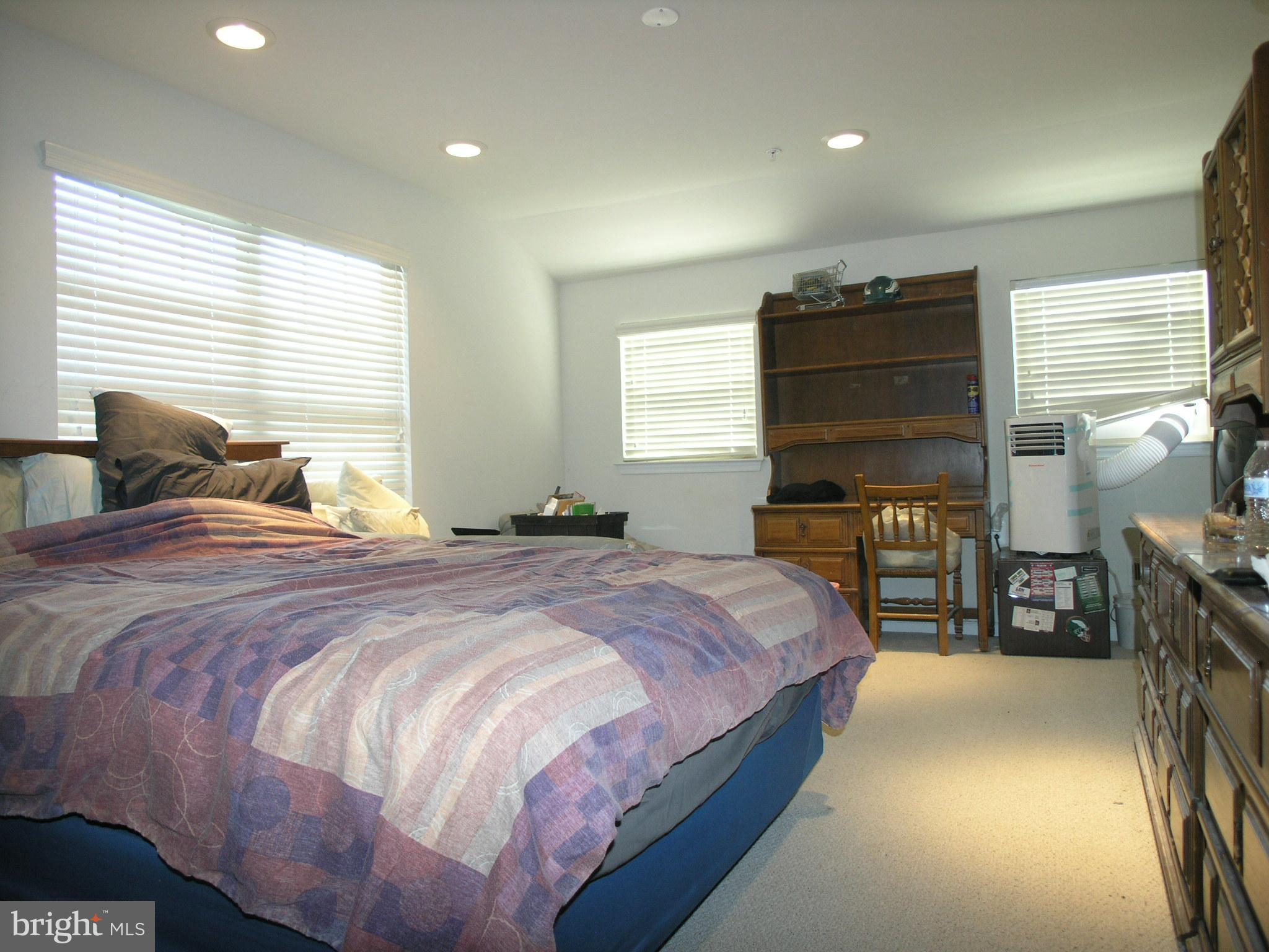 950 Nathaniel Trail Warminster, PA 18974 - Photo 18 of 26 a bedroom with a bed and a chandelier