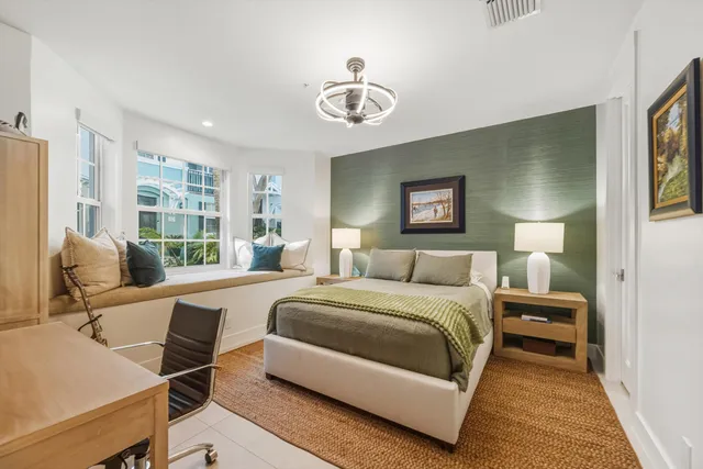 a bedroom with a bed and a desk