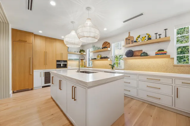 a kitchen with cabinets and window