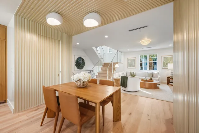 a dining room with a table and chairs