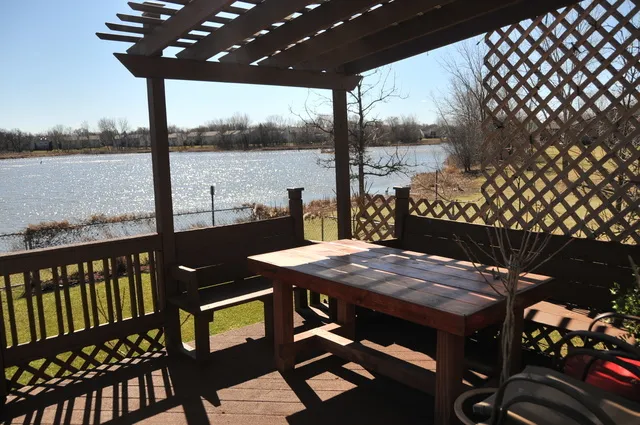 a view of a balcony with furniture