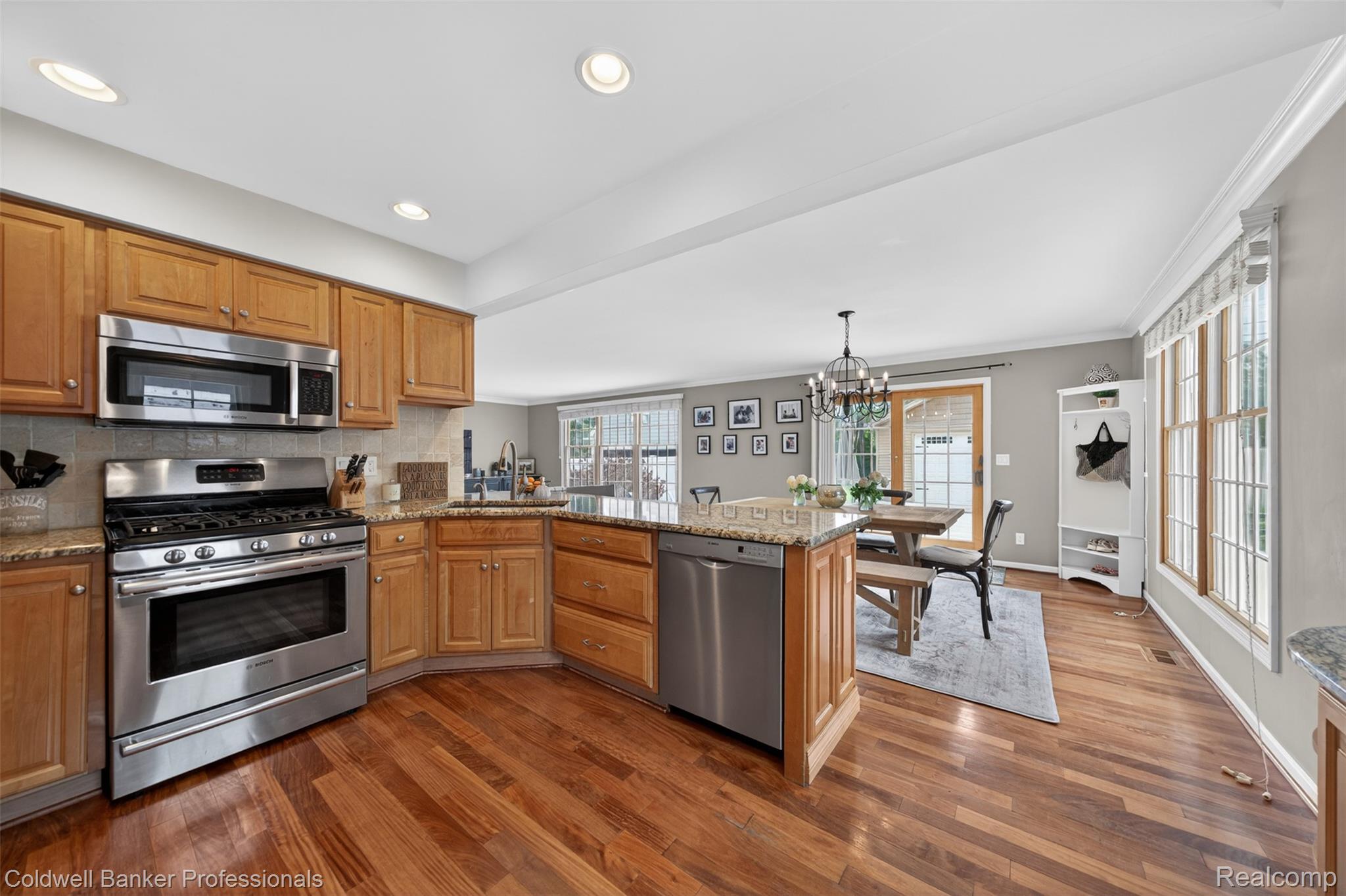 2666 Windemere Road Birmingham, MI 48009 - Photo 5 of 24 Kitchen featuring stainless steel appliances, wood-finish flooring, recessed lighting, wood cabinetry, and a stone-look countertop