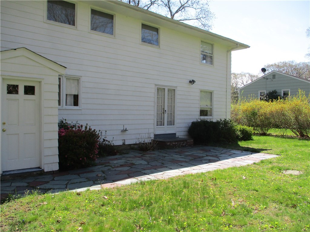67 Landmark Road Warwick, RI 02886 - Photo 3 of 20 Rear View, Patio From Dining Room & Basement Walkup