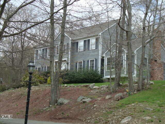 1 Marlin Road Newtown, CT 06482 - Photo 1 of 1 a view of a brick house next to a yard with large trees
