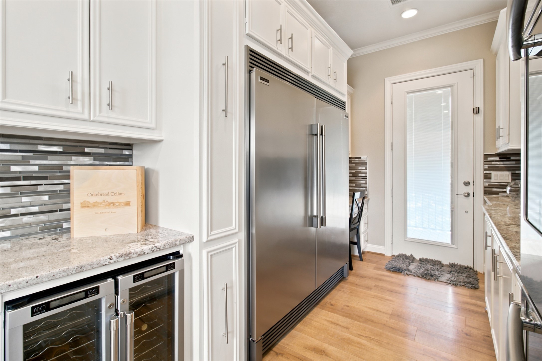201 Coco Loop Point Blank, TX 77364 - Photo 27 of 41 Take a look at this commercial refridgerator, nice! 2 door wine fridge and small desk to the right of fridge. Oh and more cabinet space.
