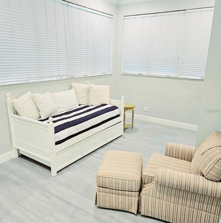 1415 Beach Club Lane Apollo Beach, FL 33572 - Photo 12 of 20 a living room with a couch and chandelier