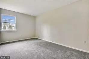 an empty room with a fireplace