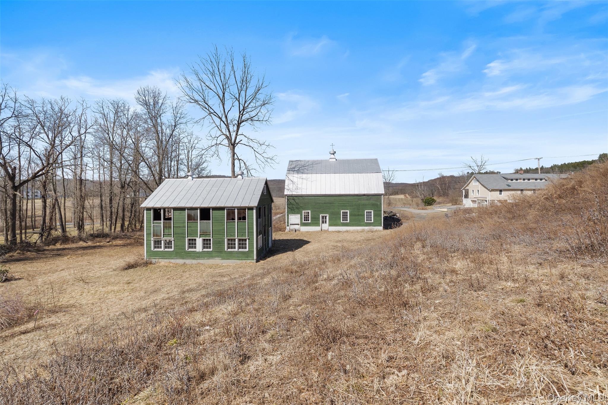 70 Barmore Road LaGrangeville, NY 12540 - Photo 42 of 47 Back of property featuring an outbuilding and a metal roof