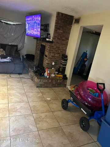 a bathroom with a toilet and a shower curtain