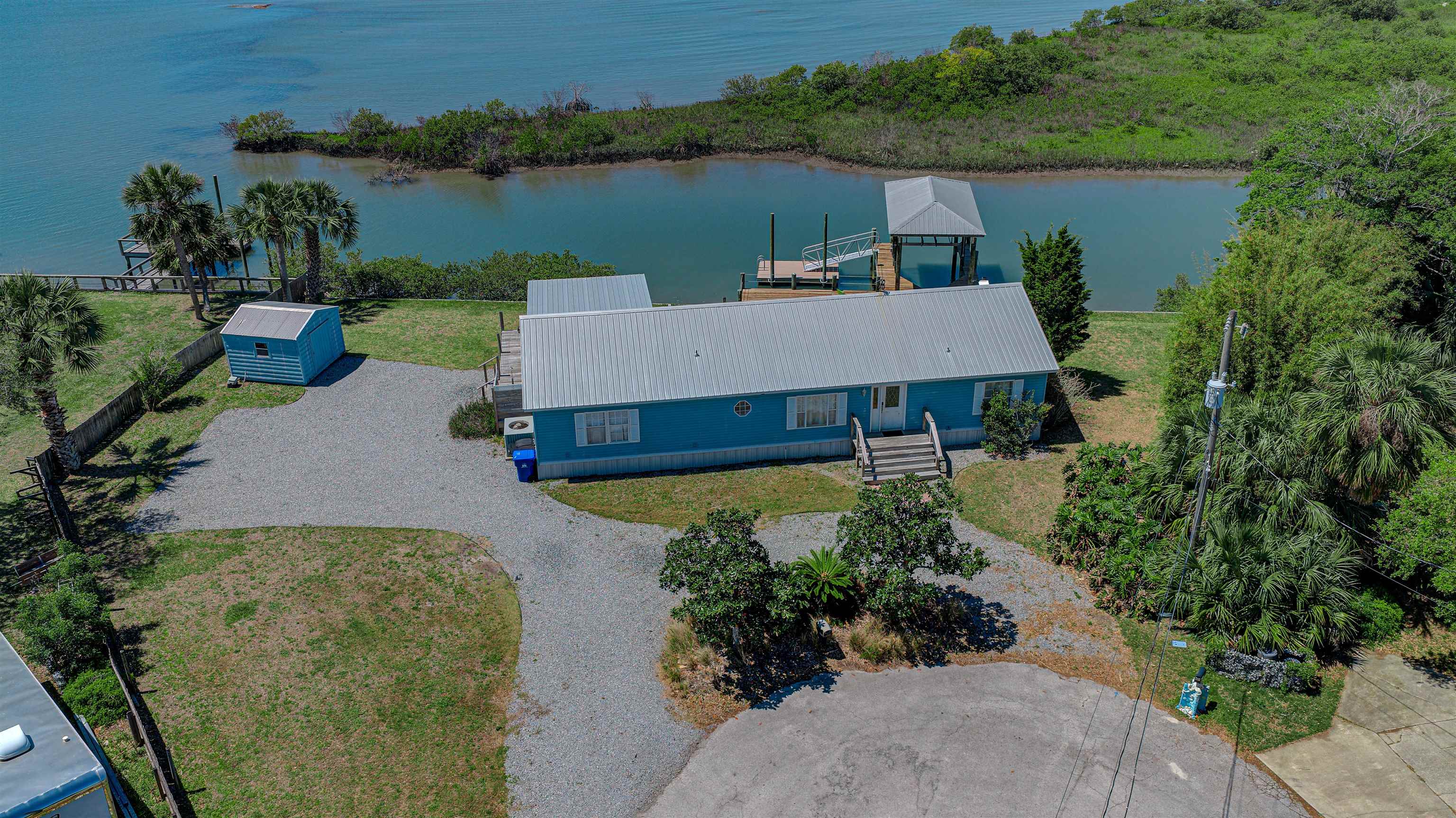 6347 Salado Road St. Augustine, FL 32080 - Photo 2 of 40 an aerial view of a house with outdoor space and lake view