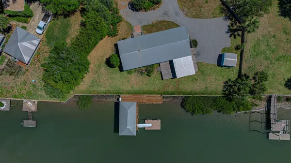 an aerial view of house with yard swimming pool and outdoor seating