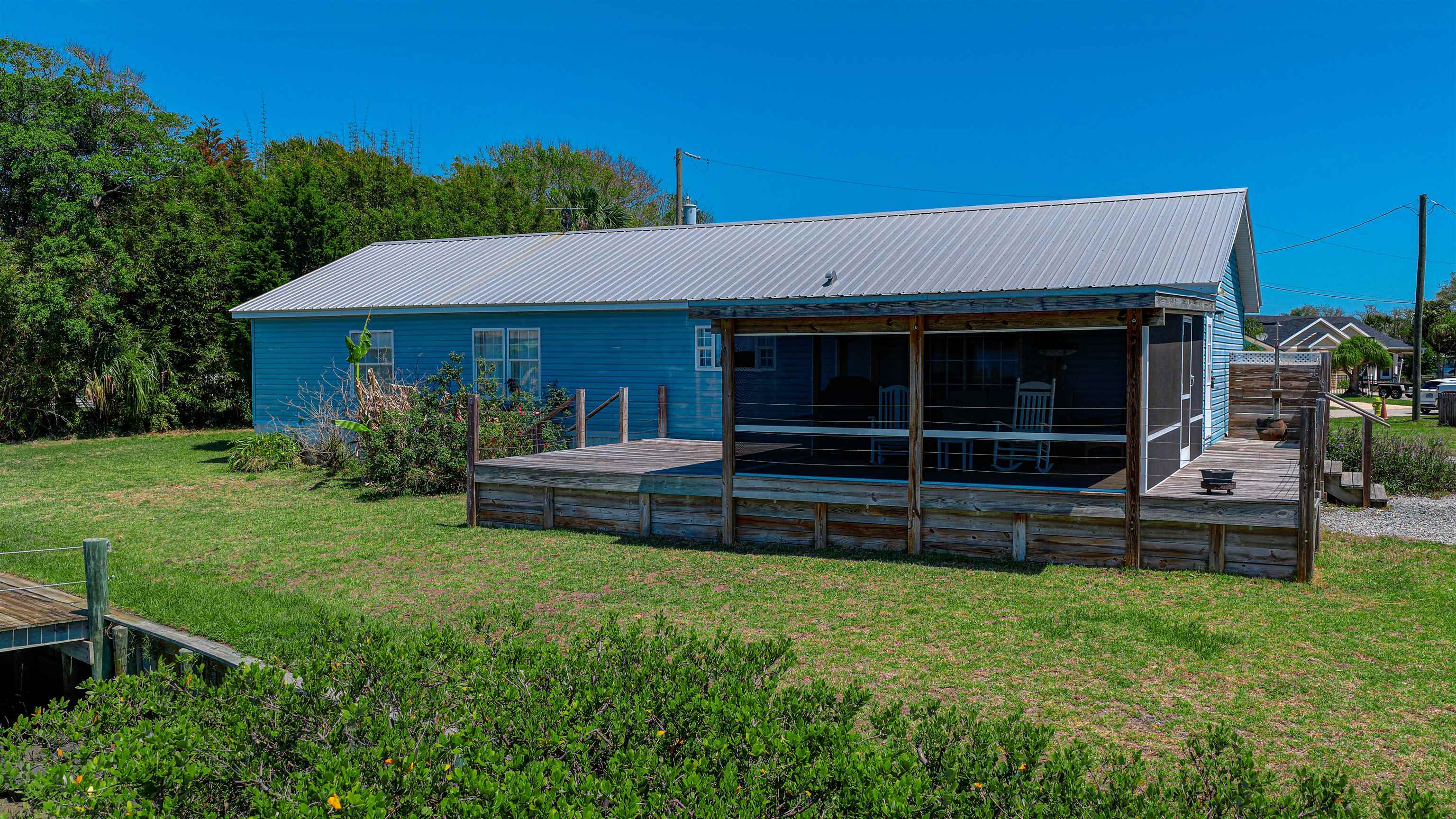 6347 Salado Road St. Augustine, FL 32080 - Photo 22 of 40 a view of a house with a yard