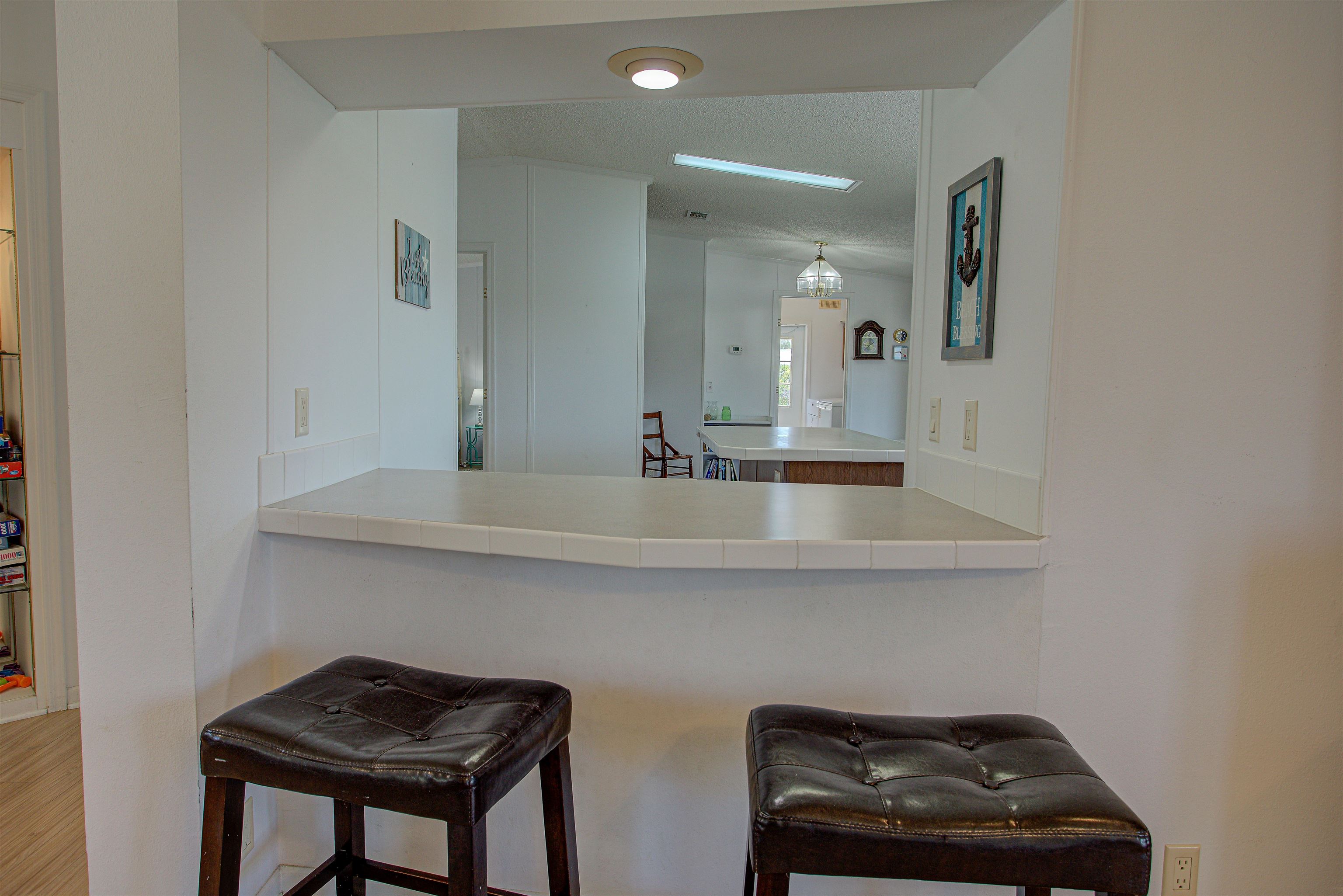 6347 Salado Road St. Augustine, FL 32080 - Photo 26 of 40 a bathroom with a sink a toilet and a mirror
