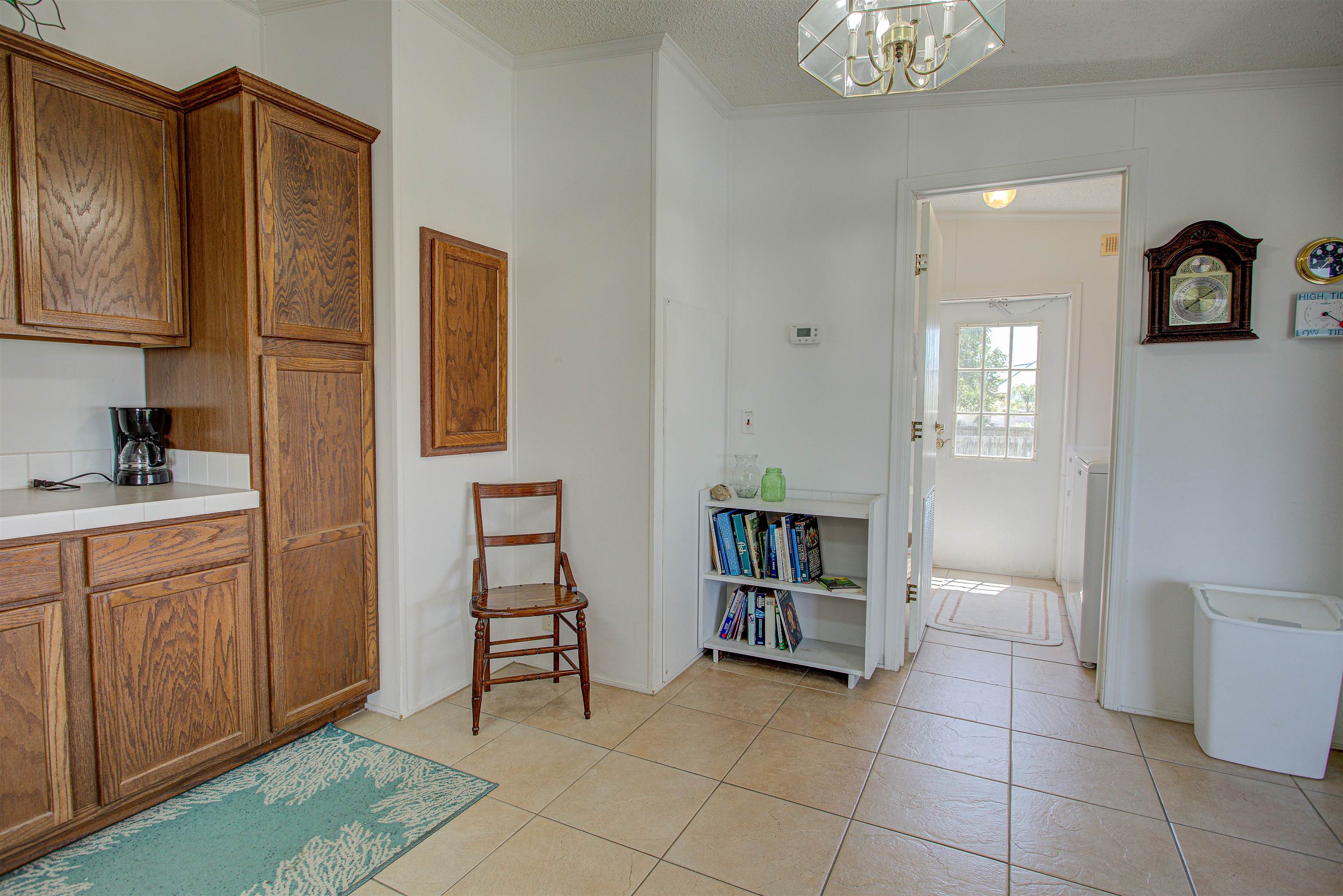 6347 Salado Road St. Augustine, FL 32080 - Photo 30 of 40 a view of cabinets with wooden floor and a window