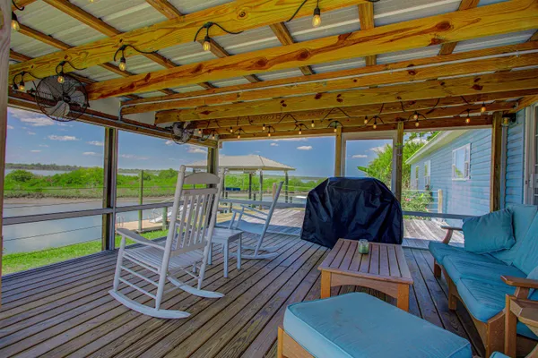 a view of a patio with a table chairs and a patio