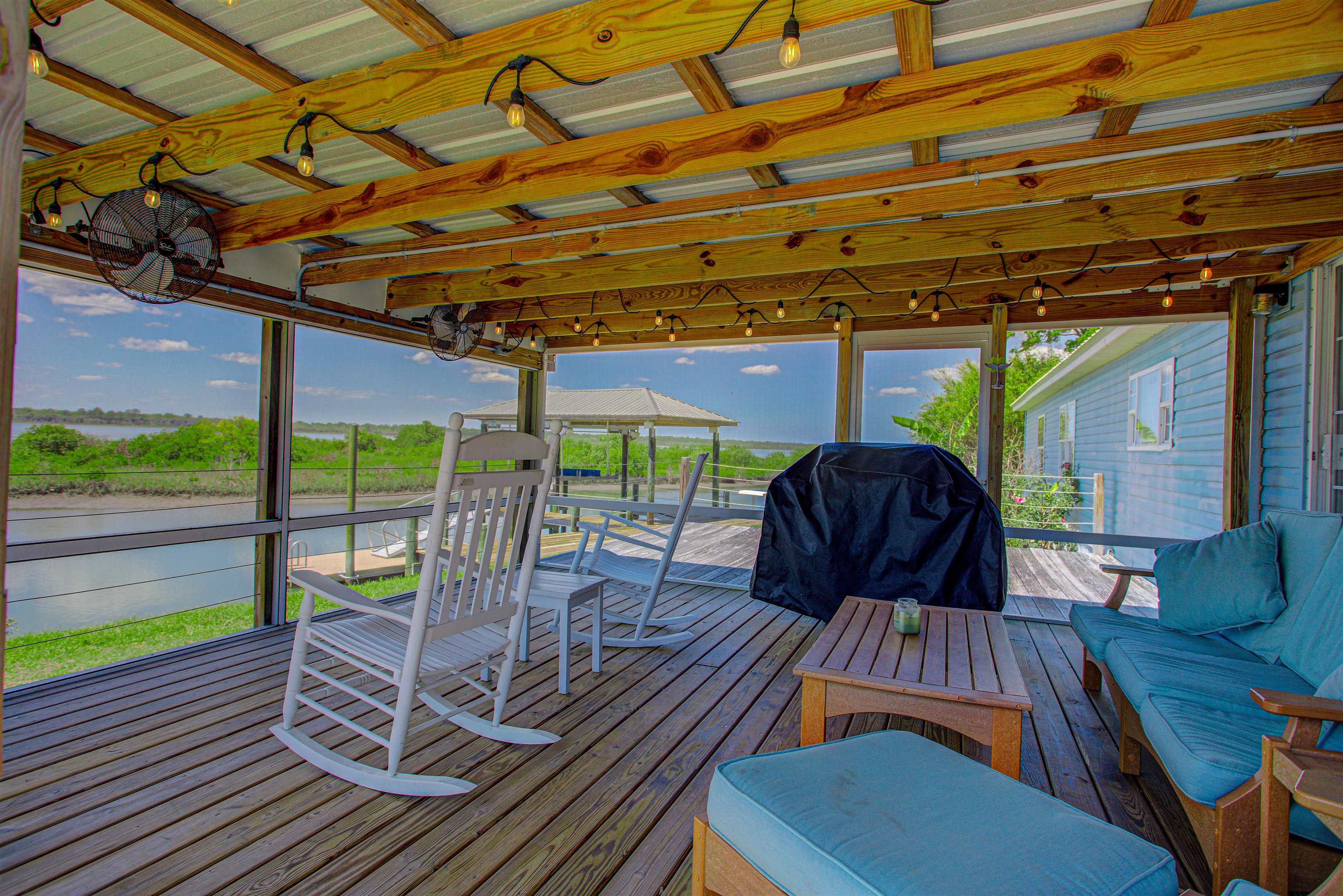 6347 Salado Road St. Augustine, FL 32080 - Photo 3 of 40 a view of a patio with a table chairs and a patio