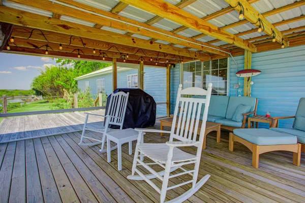 a patio with wooden cabinets and outdoor space