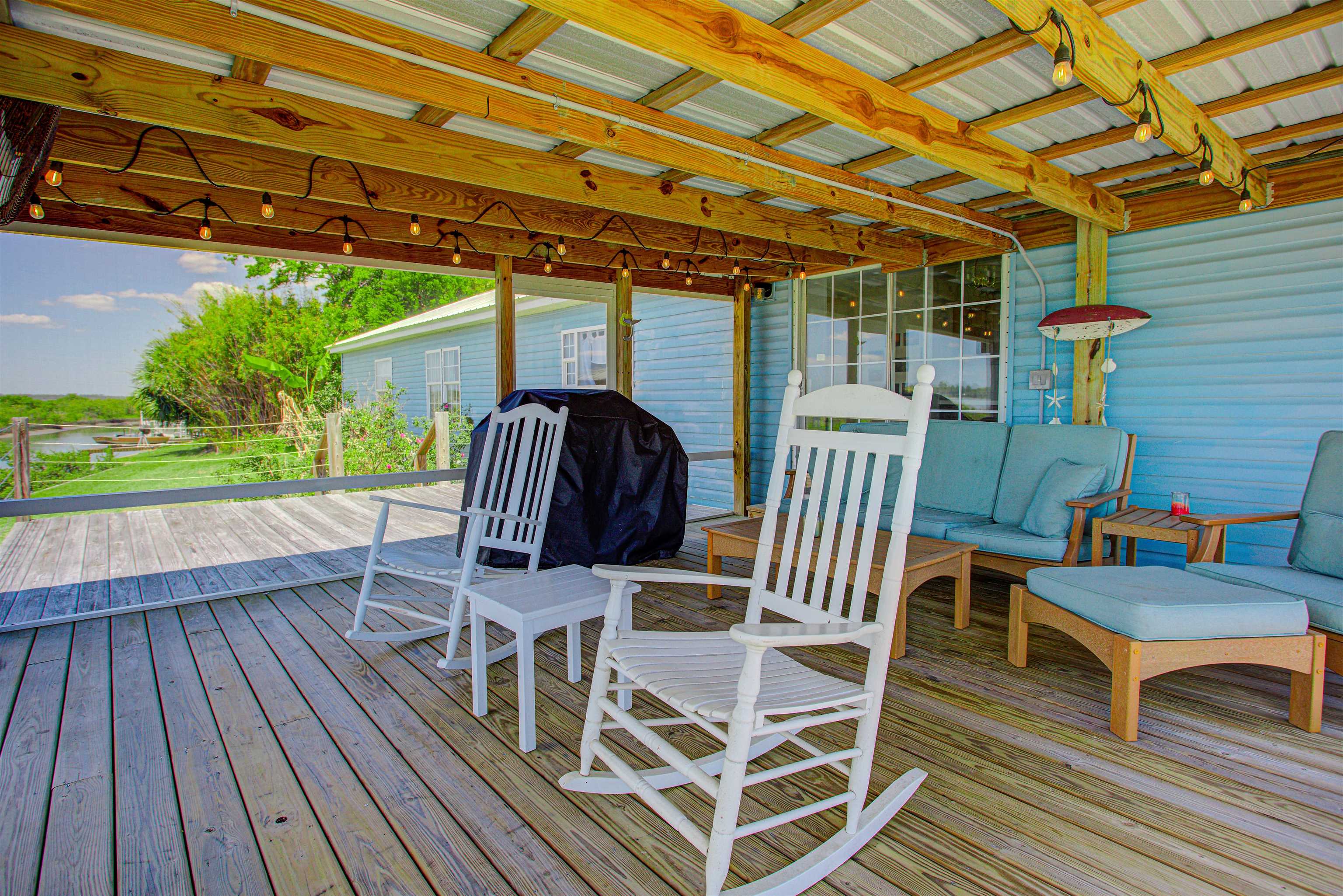 6347 Salado Road St. Augustine, FL 32080 - Photo 36 of 40 a patio with wooden cabinets and outdoor space