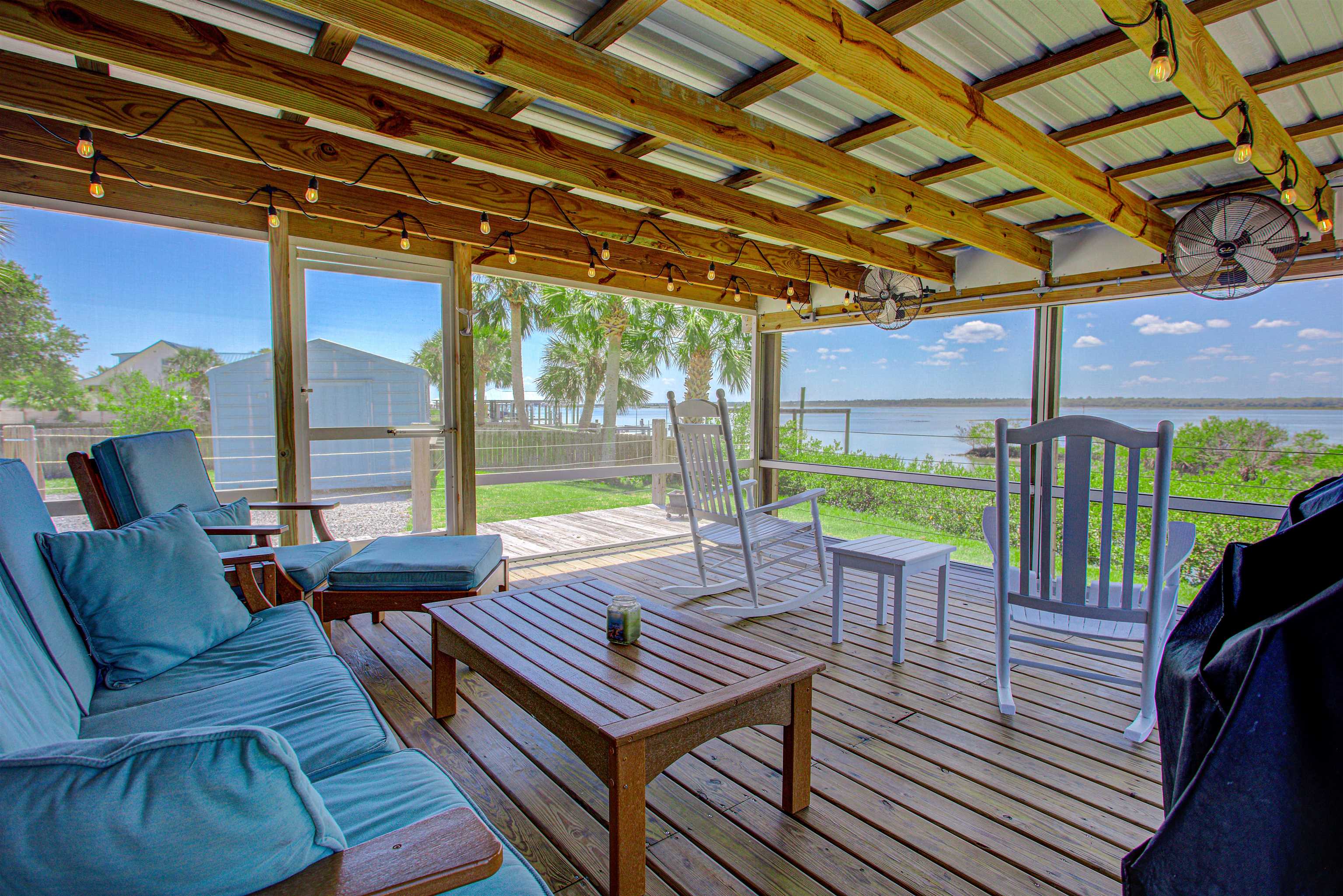6347 Salado Road St. Augustine, FL 32080 - Photo 37 of 40 a view of a patio with a table and chairs