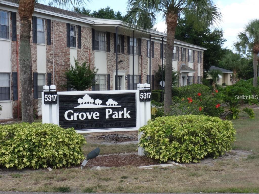 5317 Curry Ford Road, Unit P104 Orlando, FL 32812 - Photo 1 of 9 a view of a street sign under a large tree