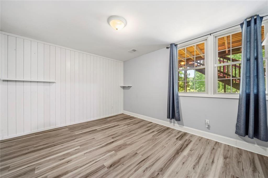 2702 Davenport Road Northwest Duluth, GA 30096 - Photo 26 of 48 an empty room with wooden floor and windows
